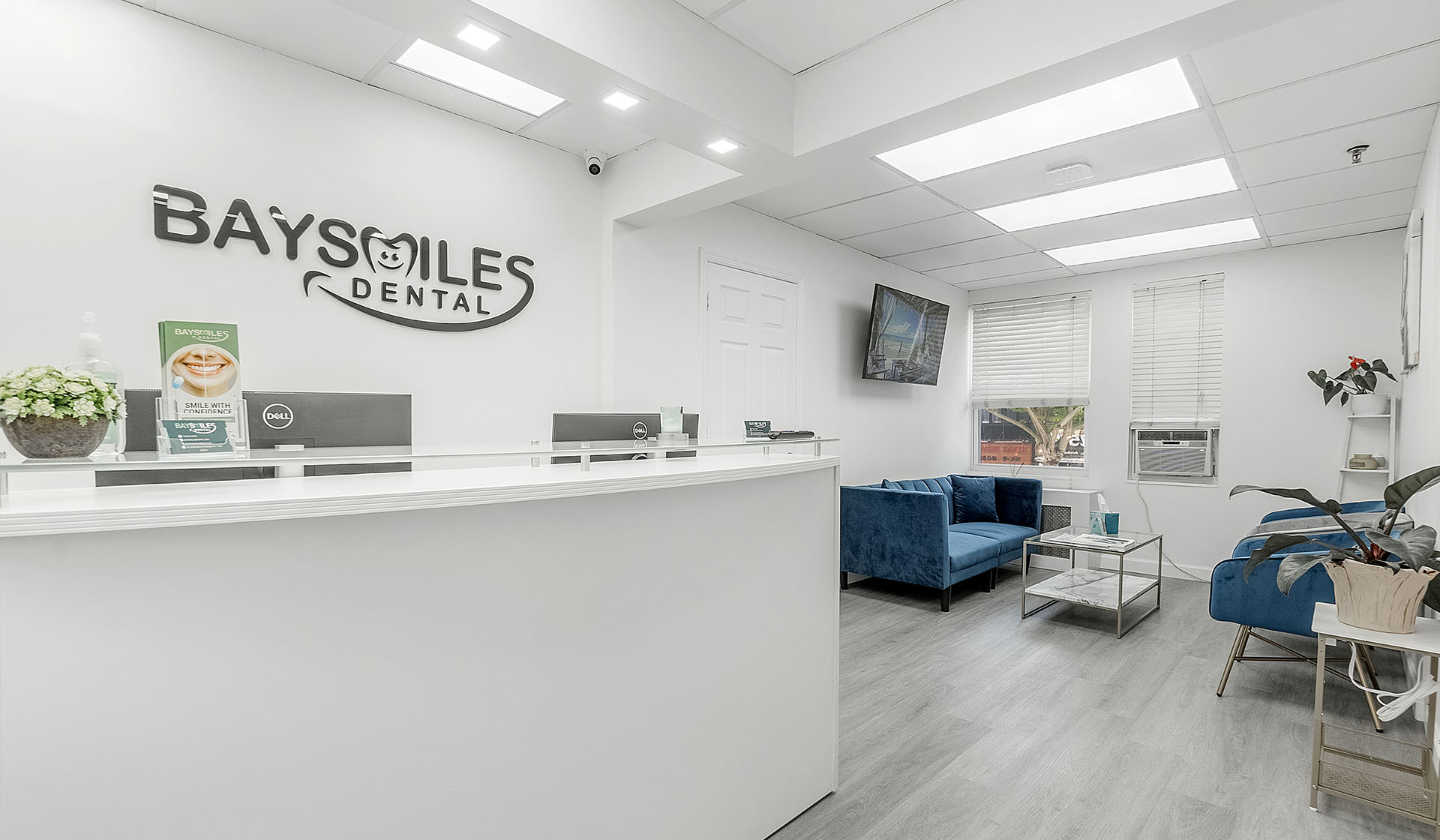 Dental clinic interior with equipment and a chair in front of a window.